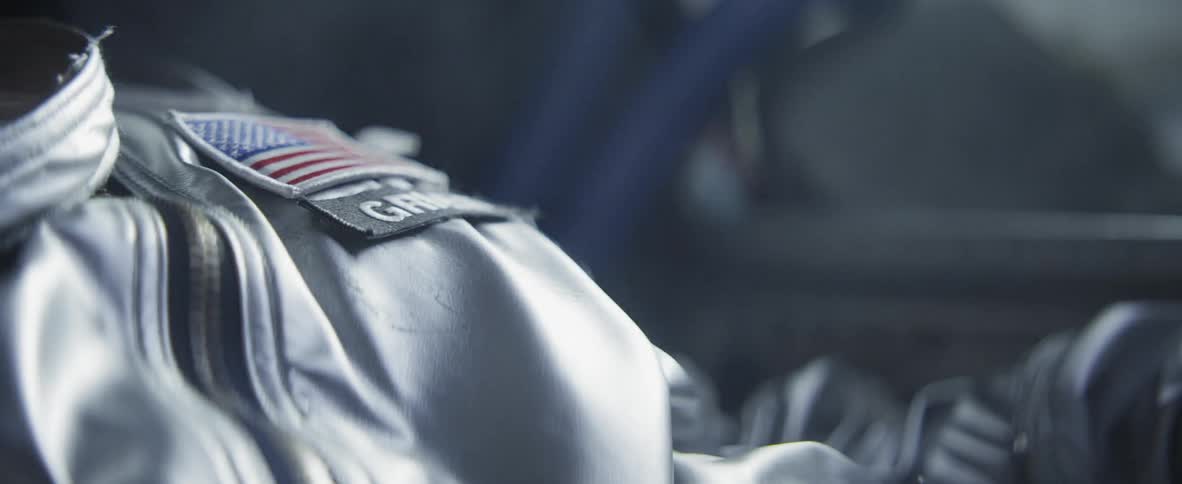 Close up of a uniform with an american flag on it