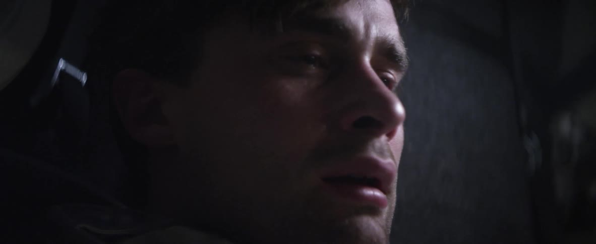Man crying in a dark area
