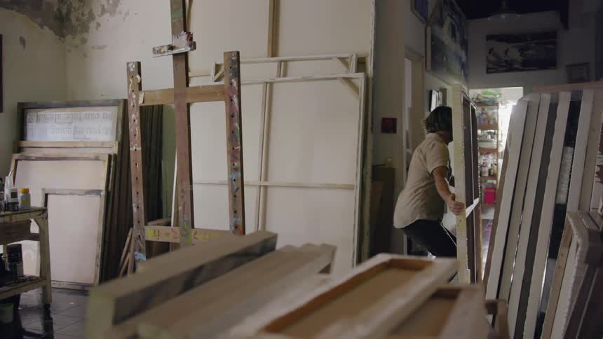 Man repositions large canvas