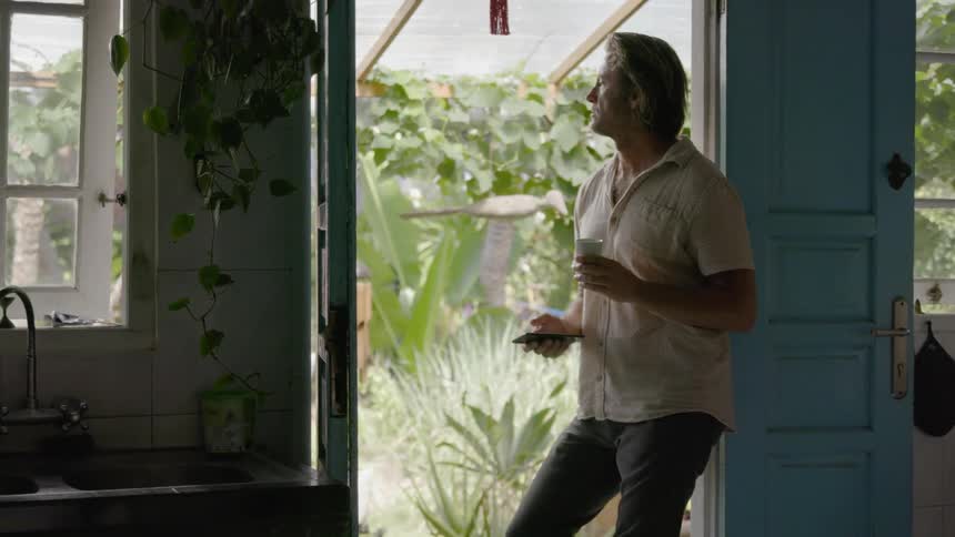 Man stands in an open door