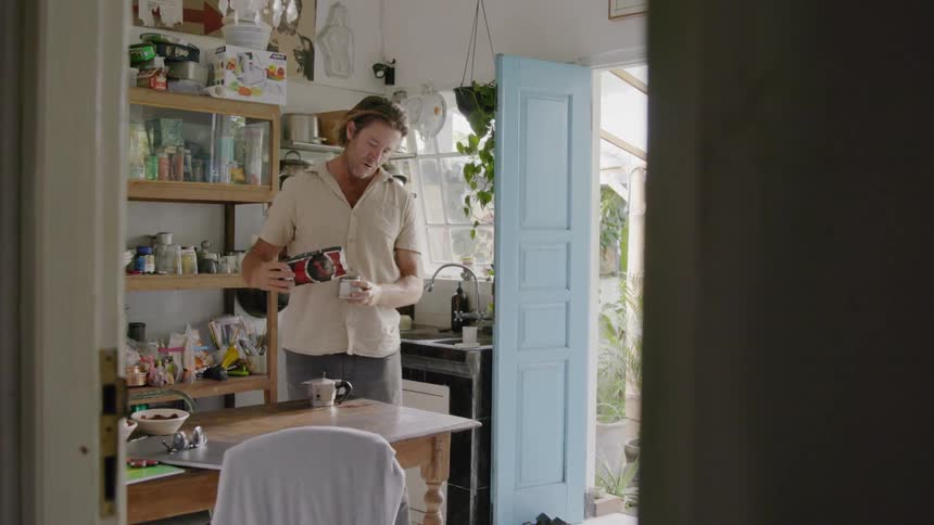 Man makes coffee at home