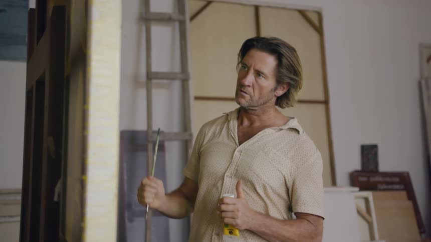 A man creates a painting