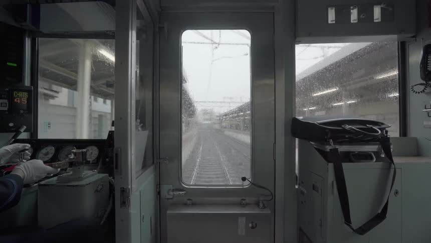 A conductor operates a passenger train