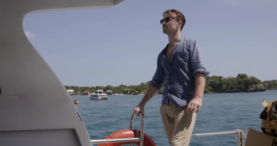 A man rides on a boat