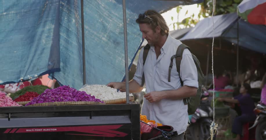 Man shops in an outdoor market