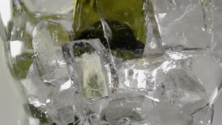 Ice cubes jostle in a cup