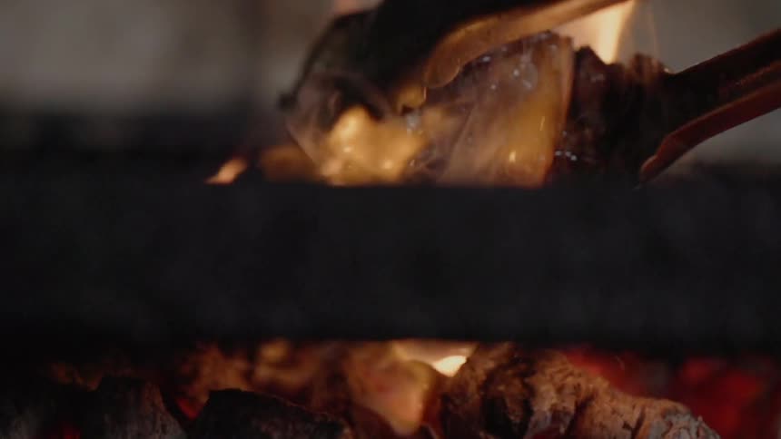A steak is cooked on a grill