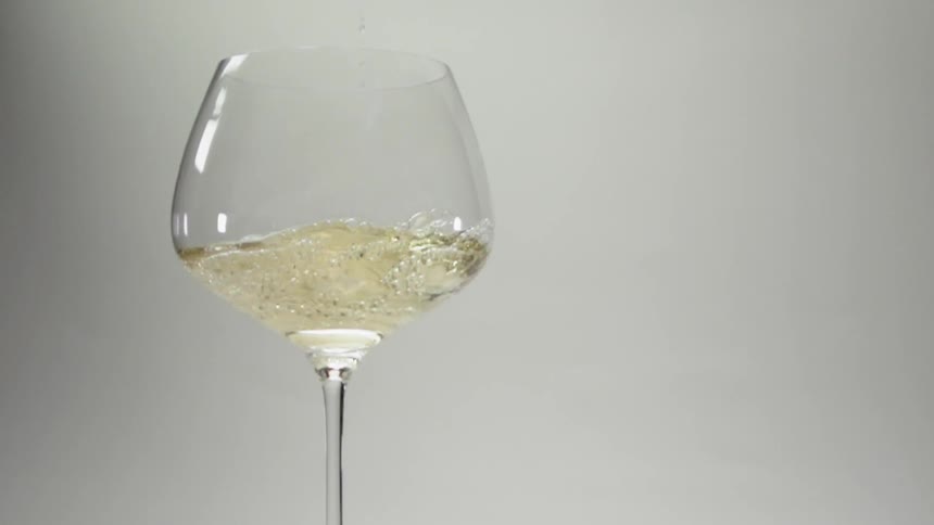Wine pours into a glass