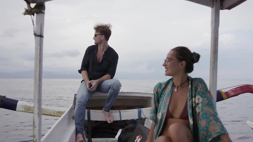 Man and woman riding on boat