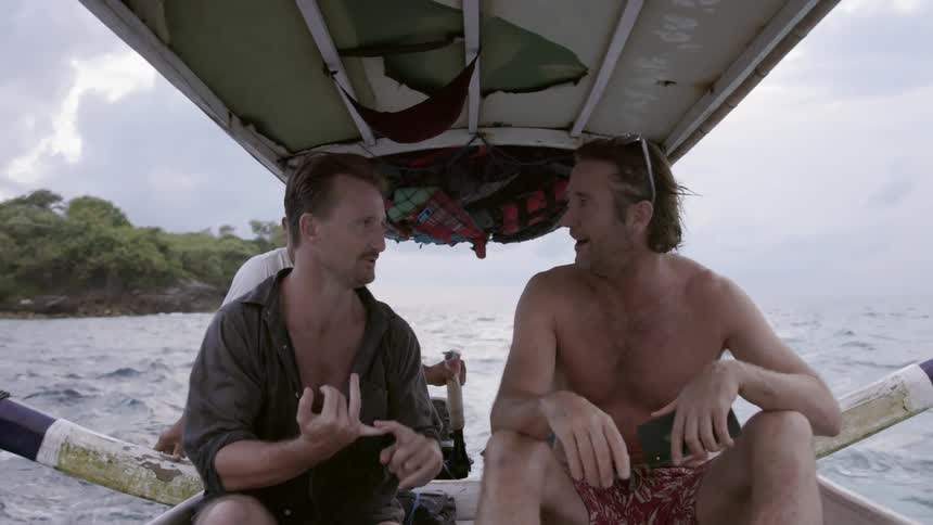 Men talking and riding on boat