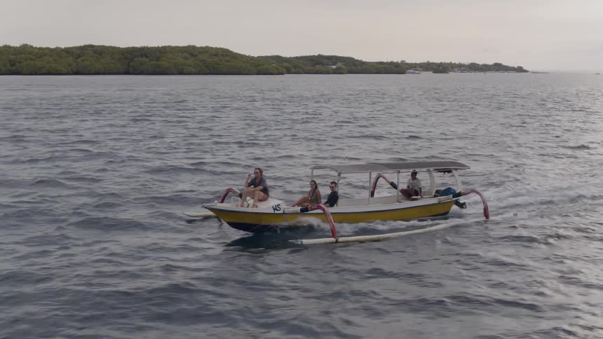 A boat speeds on the water