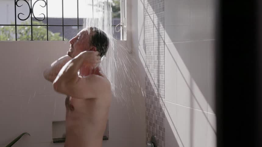 A man takes a shower