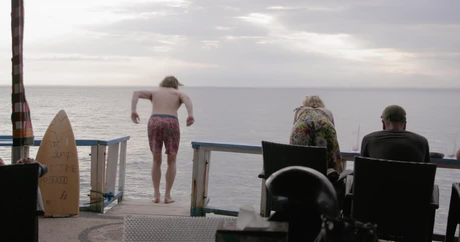 Man jumps into the  ocean
