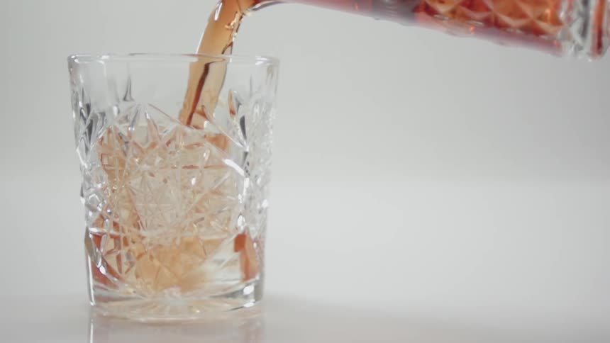 Tea being poured into a glass