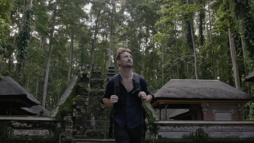 Man hikes in a jungle