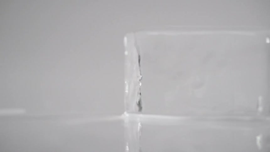 And ice cube spins on a surface