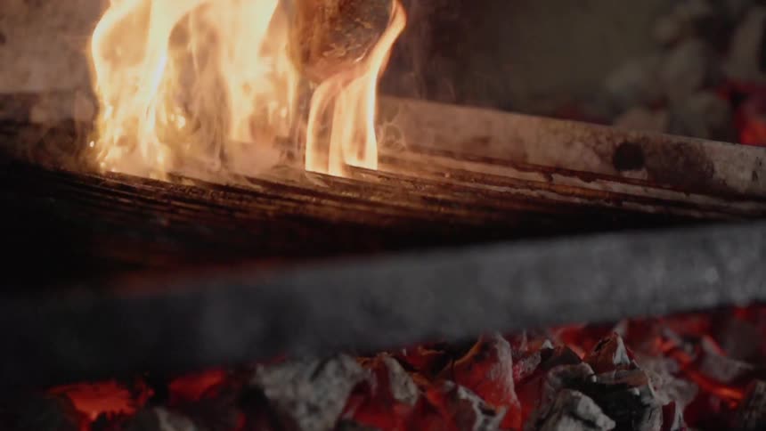 A steak is cooked on a grill