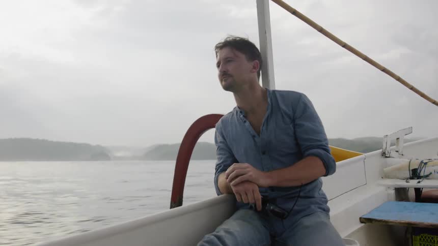 Man rides in a boat
