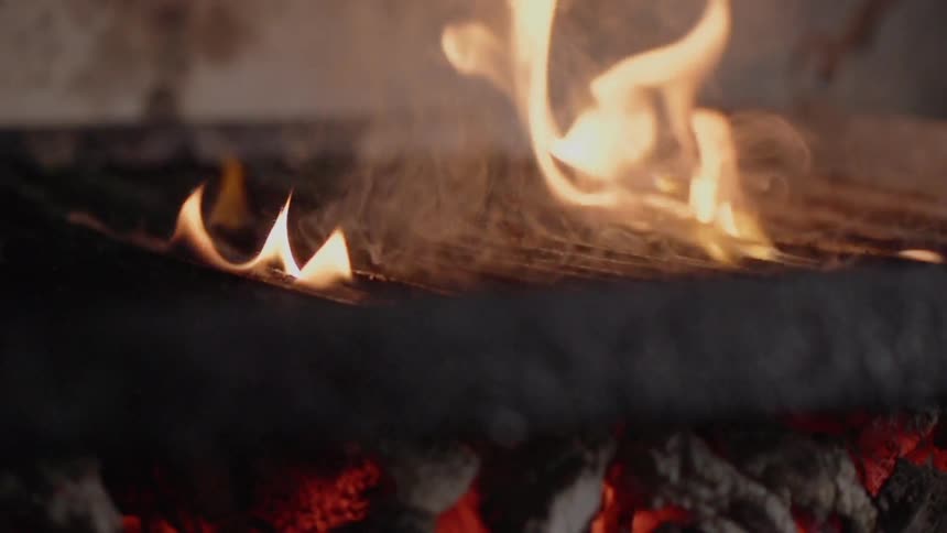 A steak is cooked on a grill