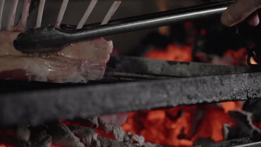 A steak is cooked on a grill