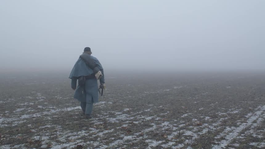 The soldier marches over the field