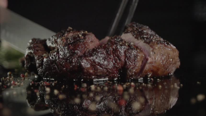 Man cutting meat with a knife