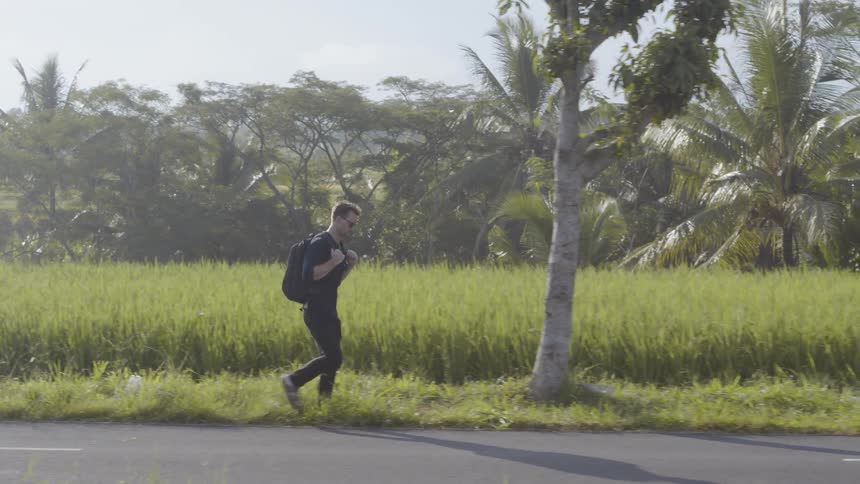Man walks along a rural road