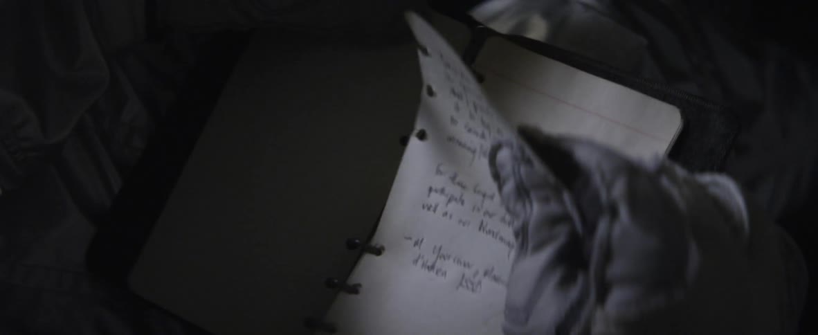 A person writing on paper