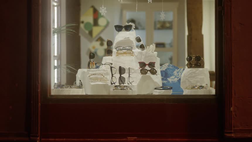 Glasses sit in a storefront window display