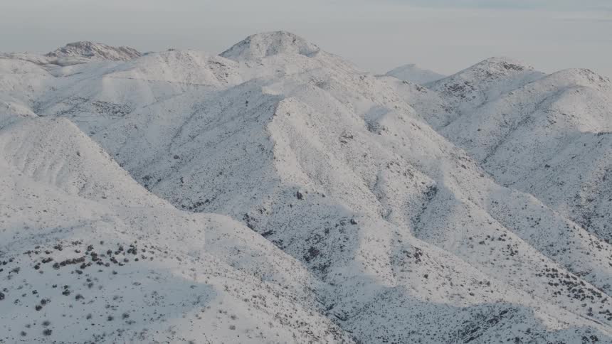 Snow covers mountains and hills