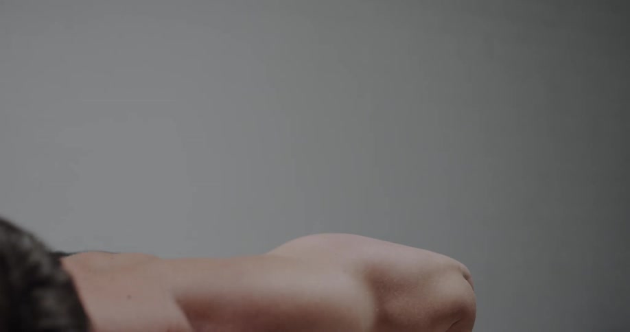 Shirtless man does push ups