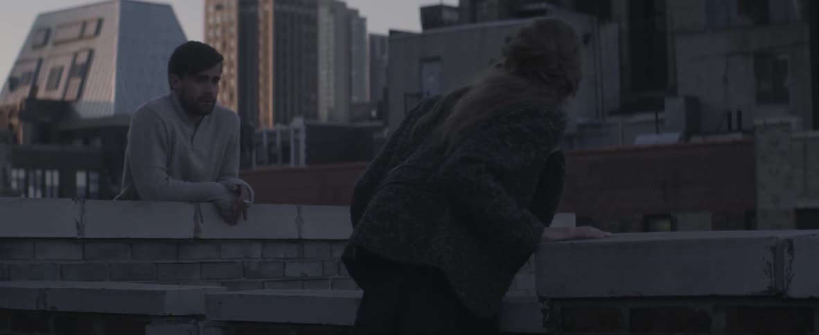 A person resting on a wall