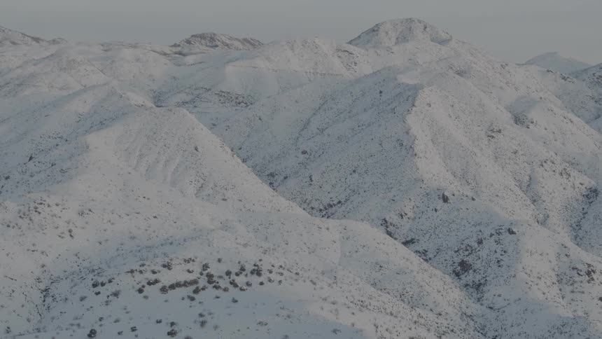 Snow covers mountains and hills