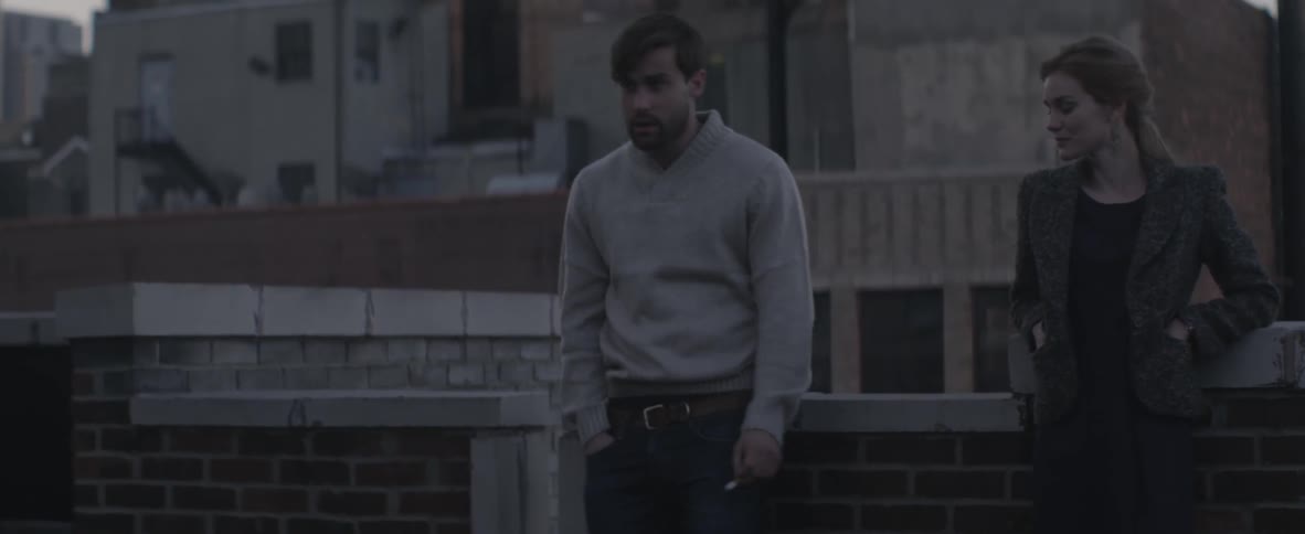 Man walking across to a woman and shaking her hand
