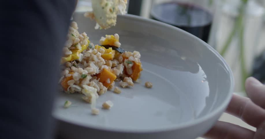 Food gets served onto a plate