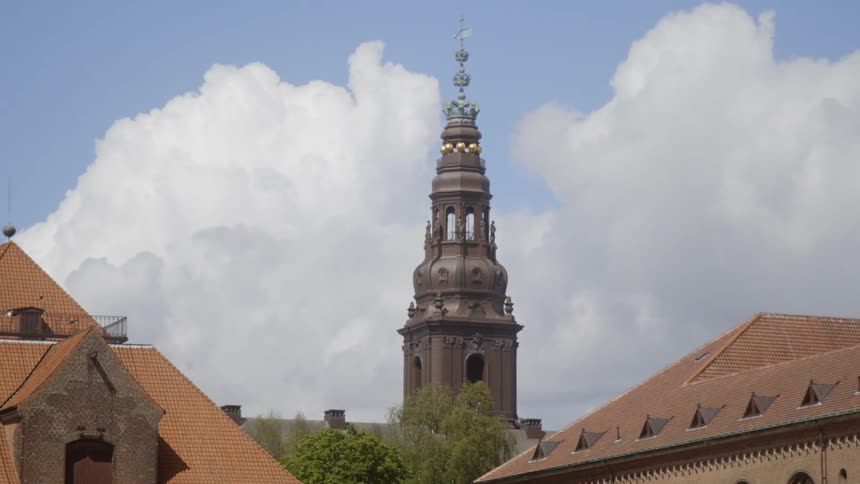 Clouds float above a city building