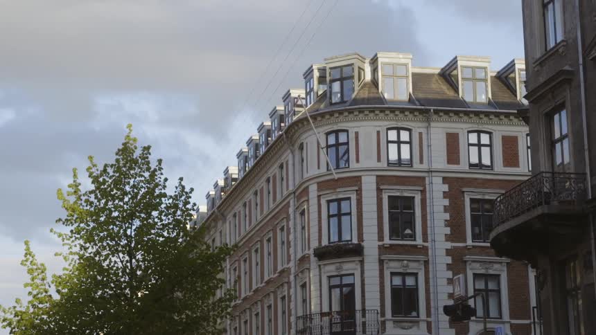 Clouds float above a city building