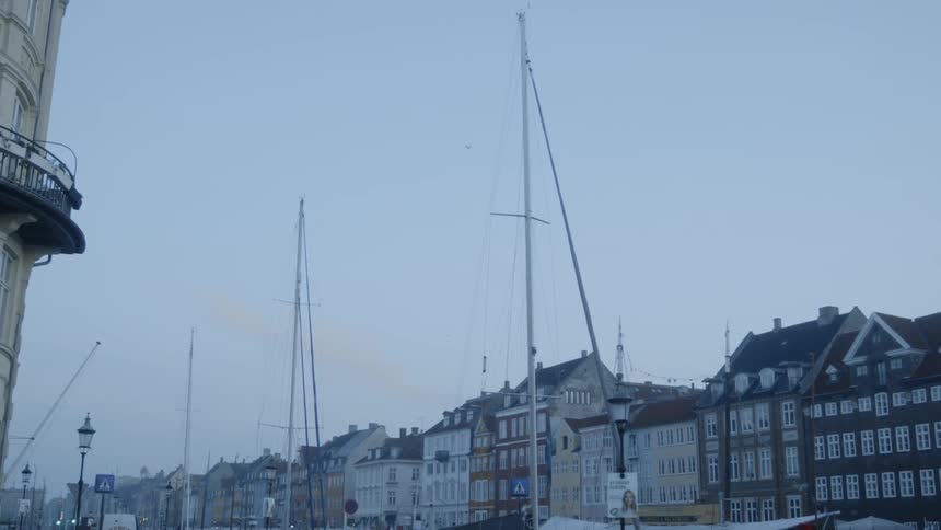 Ships docked near buildings