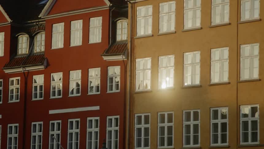 Sunlight shines on city buildings