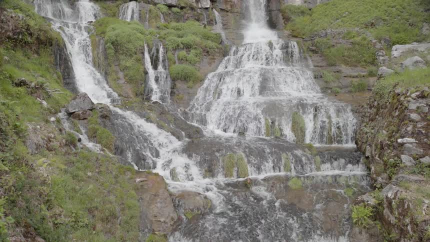 Waterfalls flow over a cliff