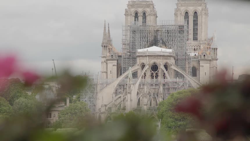 The large building ahead is made of stone