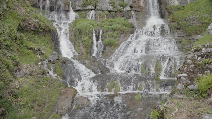 Waterfalls flow over a cliff