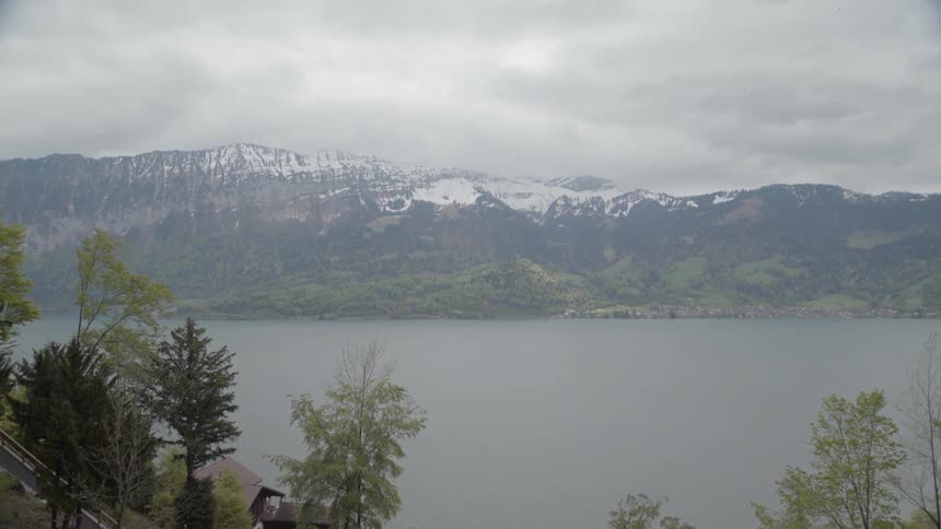 Clouds float above a mountain lake