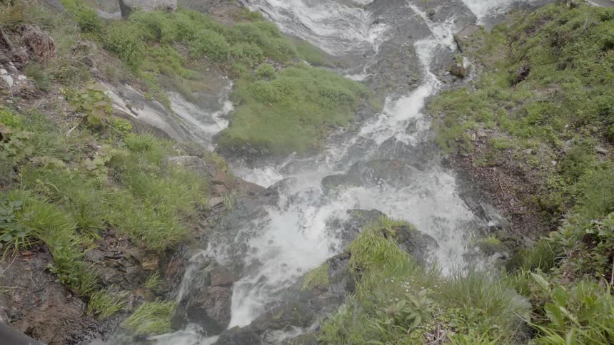 Water flows down a rocky slope