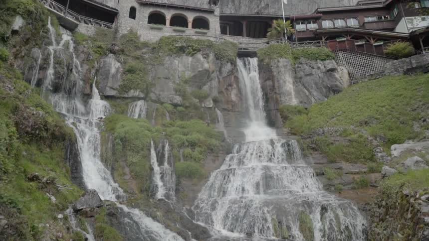 Waterfalls flow over a cliff