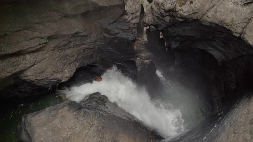 The water swirls down into the cavern below