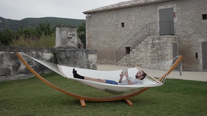 A man is lying reading