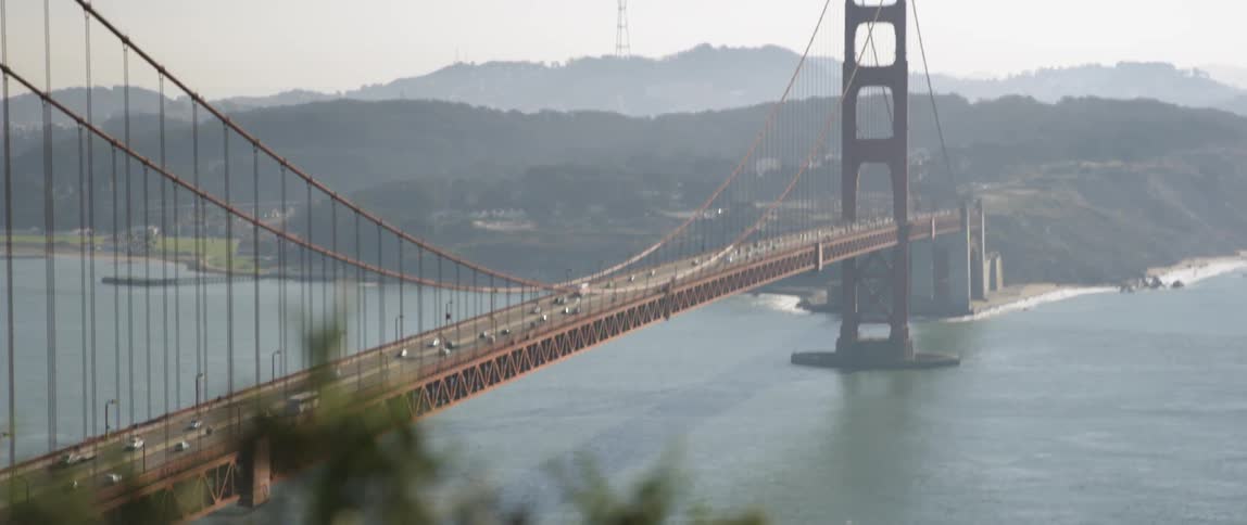 Cars drive on the golden gate bridge