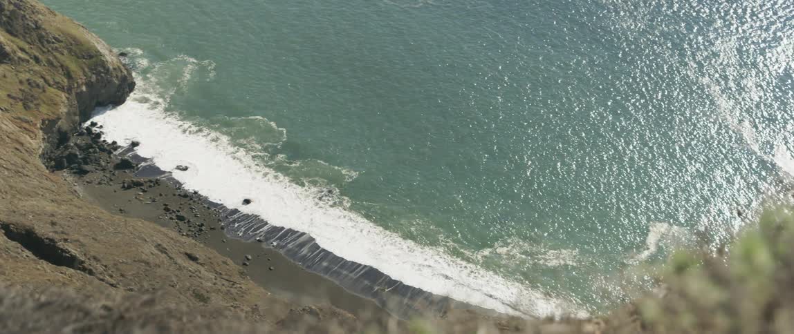 Ocean waves crash into a beach