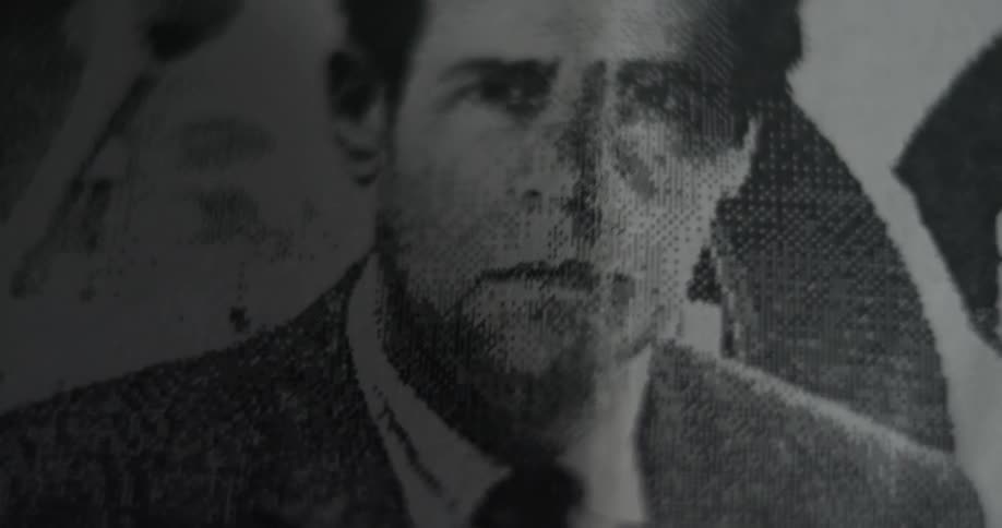 Close up of a photo of a man on a newspaper